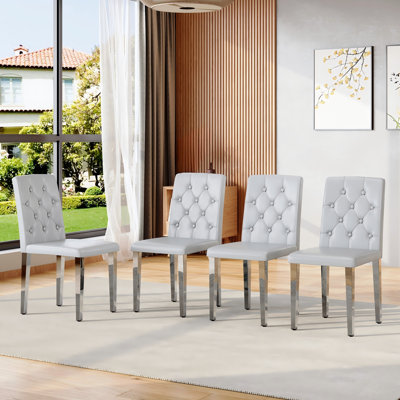 This Minimalist Light Gray PU Dining Chair Set Features A Snap-On Backrest That Conforms To The Human Body's Curves, And Sturdy And Durable Silver Metal Chair Legs, Balancing Seating Comfort With An Overall High-End Feel.