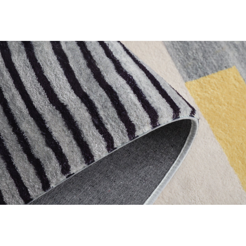 Tapis gris touffeté à la main