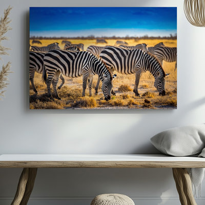 Toile dans une vaste savane, une scène vibrante se déploie comme un art mural