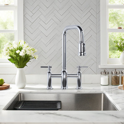 Bridge-Style Kitchen Faucet With Dual Handles And A Pull-Down Spray Head, Designed For Installation On A 3-Hole Kitchen Sink