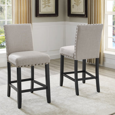 Tabourets de comptoir en tissu avec garniture cloutée Carliana, ensemble de 2