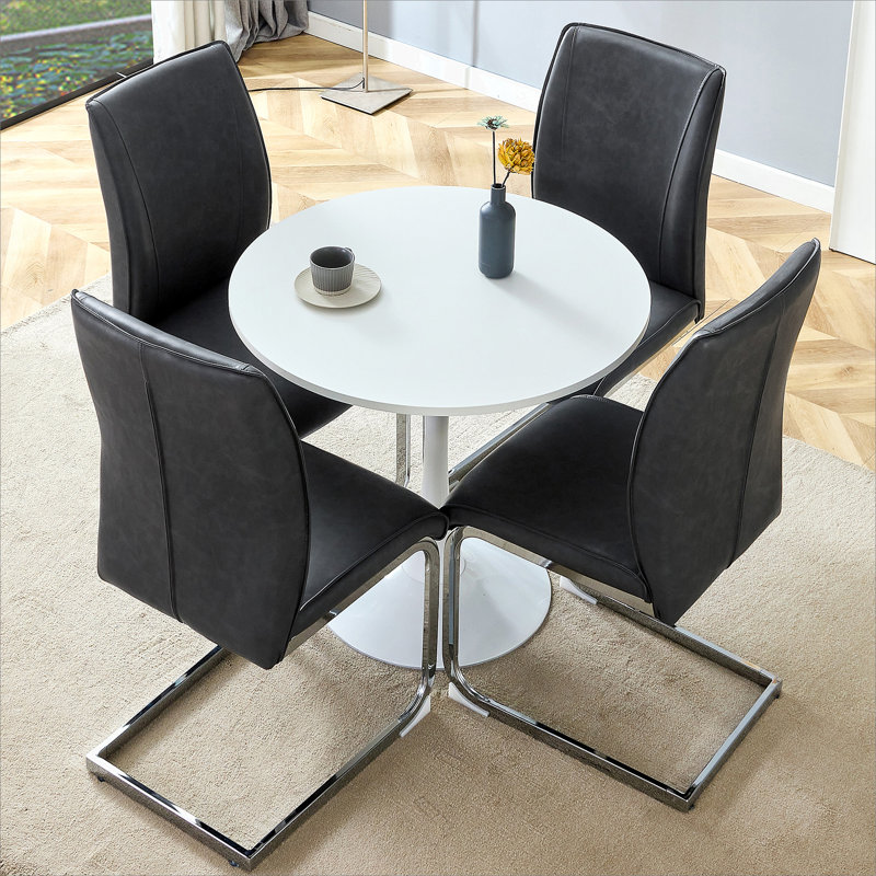 Ensemble de table et de chaises. Petite table ronde stable en forme de verre - 31,9 po x 31,9 po avec chaise en polyuréthane doux et confortable avec pieds en métal arqués argentés.