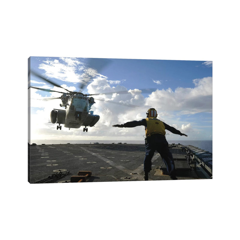 Aviation Boatswain's Mate Directs A CH-53E Super Stallion by Stocktrek Images - Wrapped Canvas Print, 30.48 cm H x 45.72 cm W