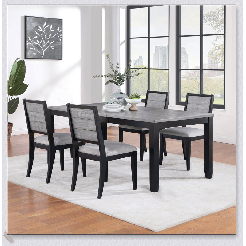 Ensemble de table de salle à manger 5 pièces gris et noir Centera avec fabrication robuste et sièges confortables, parfait pour les intérieurs modernes et rustiques.