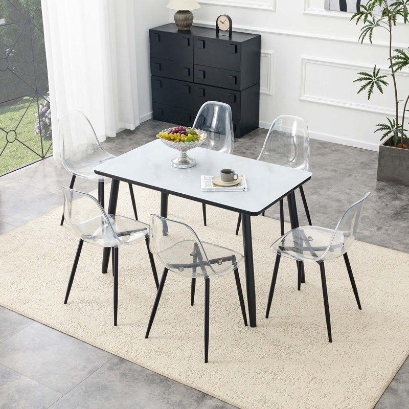 Ensemble de table et chaises de salle à manger moderne avec texture imitation marbre et sièges transparents