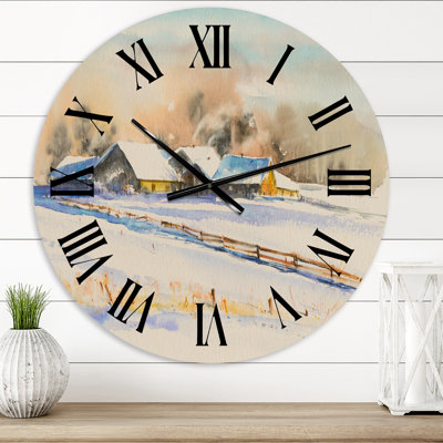 Petit village au coucher du soleil recouvert de neige - horloge murale traditionnelle
