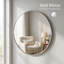Grand miroir mural rond en métal argenté avec un design incassable pour une décoration moderne
