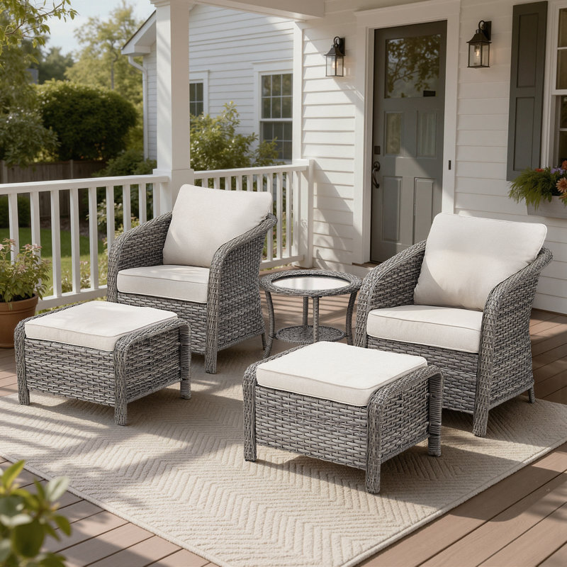 Ensemble de chaises de patio à dossier enveloppant en osier 5 pièces avec repose-pieds et table d'appoint Arcola