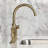 Kingston Brass Hallerbos Two-Handle 4-Hole Deck Mount Bridge Kitchen Faucet with Brass Side Sprayer-101073393