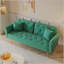 Un canapé-lit de 69,7 pouces de long recouvert de tissu de velours, avec une garniture cloutée et un coussin décoratif assorti-606242918