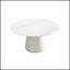 Table de salle à manger ronde moderne en pierre artificielle noire avec base en polyuréthane beige, pouvant accueillir 6 personnes pour des repas et des rassemblements élégants.-488618645-488618643