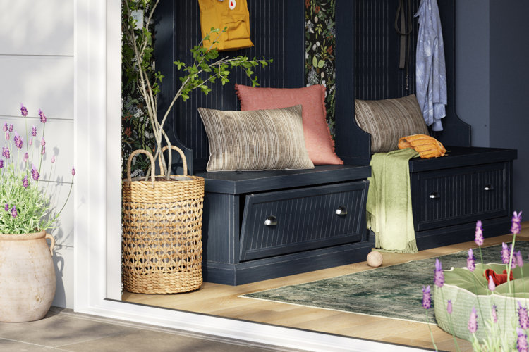 entryway with a green runner rug, black hall trees, and floral wallpaper