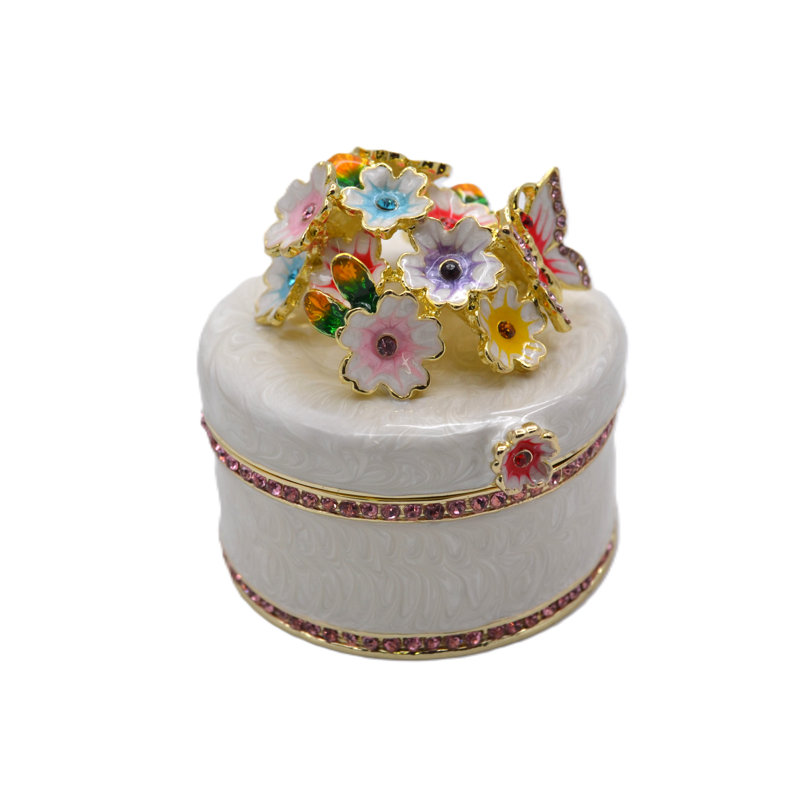 Boîte à bijoux ronde avec fleurs et papillons