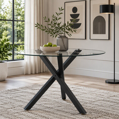Table de salle à manger ronde en verre avec structure en métal en forme de X