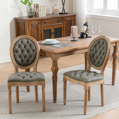 Paire de luxueuses chaises de salle à manger, pieds en bois massif, cuir artificiel PU, garniture cloutée, rembourrage confortable, ton verdâtre à la mode de 2 et ornement à boucle tirée à la main, coussin moelleux, teinte