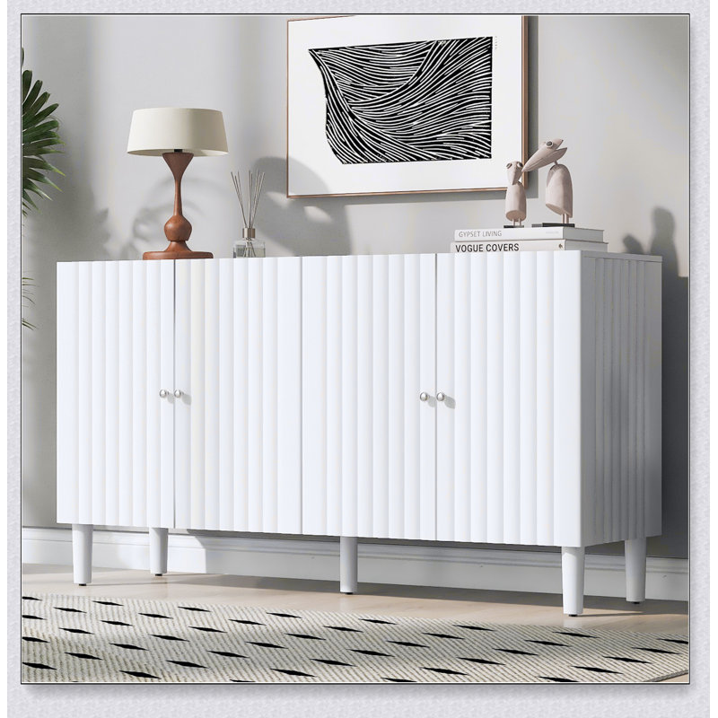 Buffet à quatre portes avec portes à motif ondulé, pieds cylindriques et poignées en métal élégantes, Blanc