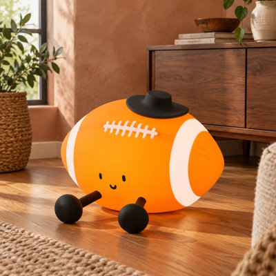 A soft silicone rugby-style football lamp brings rechargeable, dimmable night lighting with a timer to nurseries and kids' room decor, and can also serve as a birthday gift.
