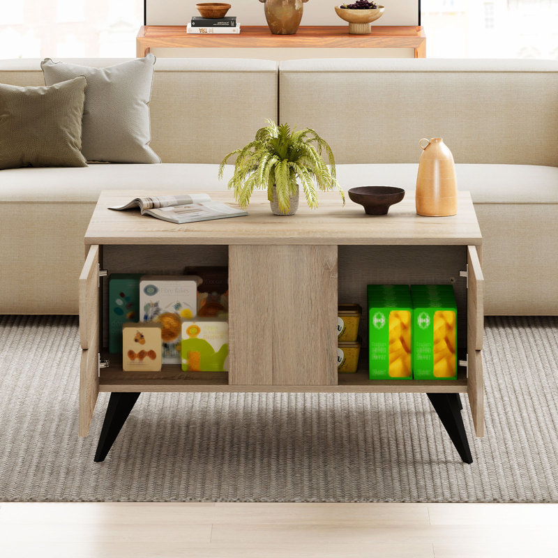 Table basse moderne avec compartiments de rangement ouverts et 3 tiroirs avec 4 pieds surélevés