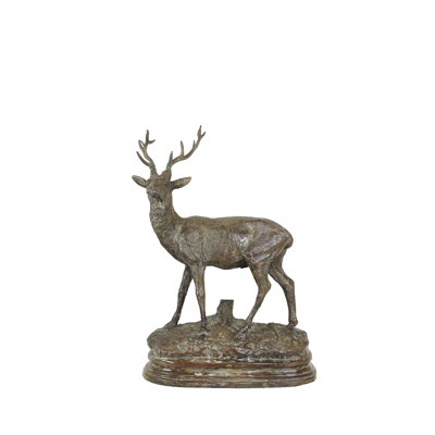 Sculpture bronze sur fond de table cerf