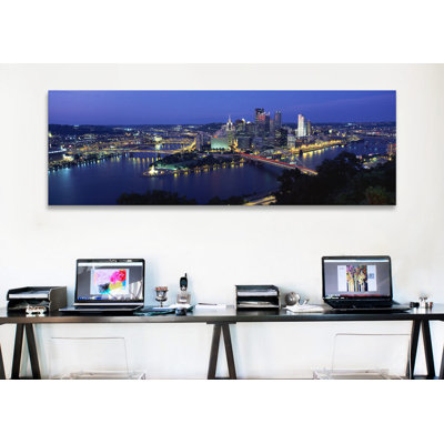 " Buildings Along A River Lit Up At Dusk, Monongahela River, Pittsburgh, Allegheny County, Pennsylvania, USA " by Panoramic Images