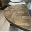 Table basse ronde grain de bois et métal noir