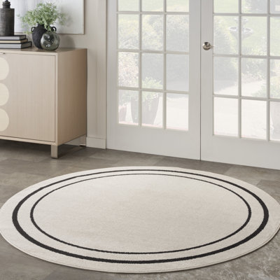 Tapis intérieur / extérieur en ivoire tissé à la machine Arvell