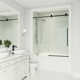 Elan E-Class 56-60" W x 66" H Sliding Frameless Tub Door with 3/8" Clear Glass