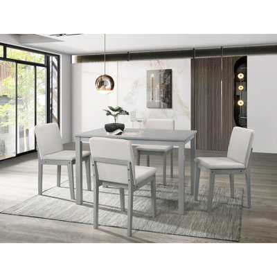 Salle à manger grise 5 pièces, table rectangulaire, 4 chaises rembourrées beiges, placage hévéa, style transitionnel avec sièges de chaises beiges, design classique
