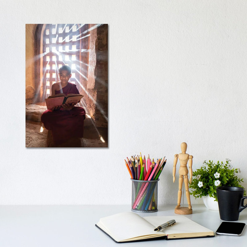 Burmese Novice Monk Reading A Book In A Temple, Bagan, Myanmar by Jan Becke - Wrapped Canvas Print, 20.32 cm H x 30.48 cm W