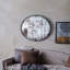 Miroir avec design rond et cadre industriel en métal