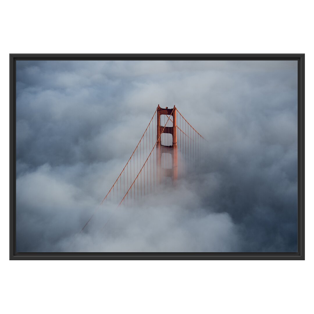 Gerahmtes Wandbild Golden Gate Bridge über den Wolken