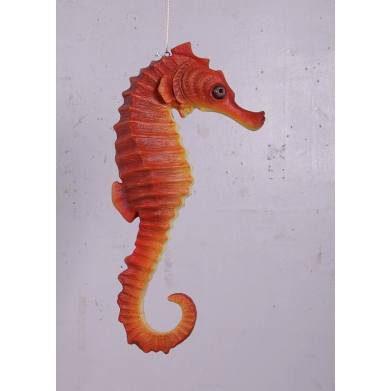 Petite statue d'hippocampe rouge