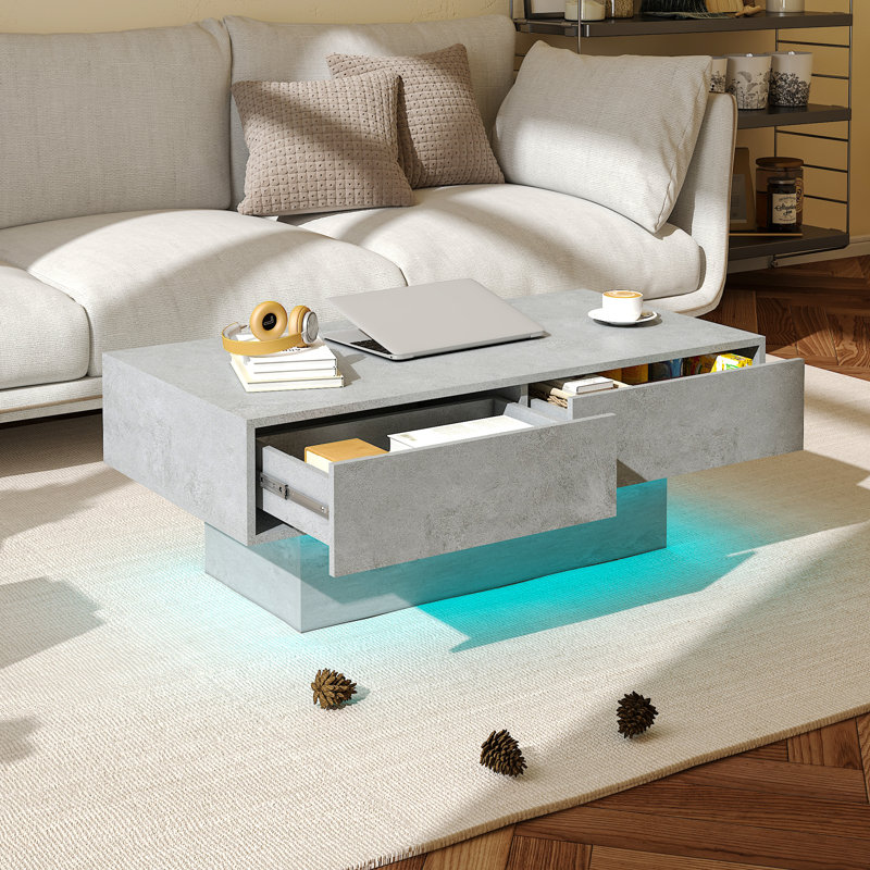 Table basse rectangulaire en béton gris avec 2 tiroirs et rangement ouvert