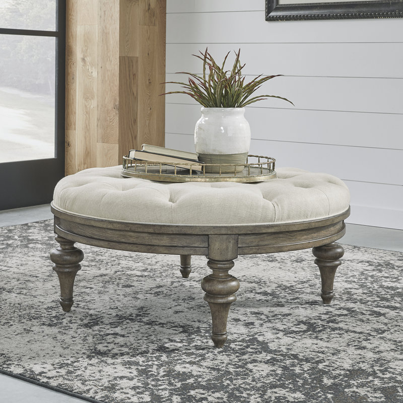 Arbrielle Tufted Round Linen Cocktail Ottoman with Wood Trim