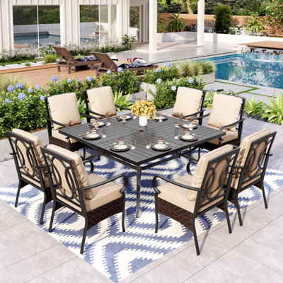 Sutiya 8 - Person Stainless Steel Patio Dining Set Umbrella Hole Included Square Table with Cushions Included