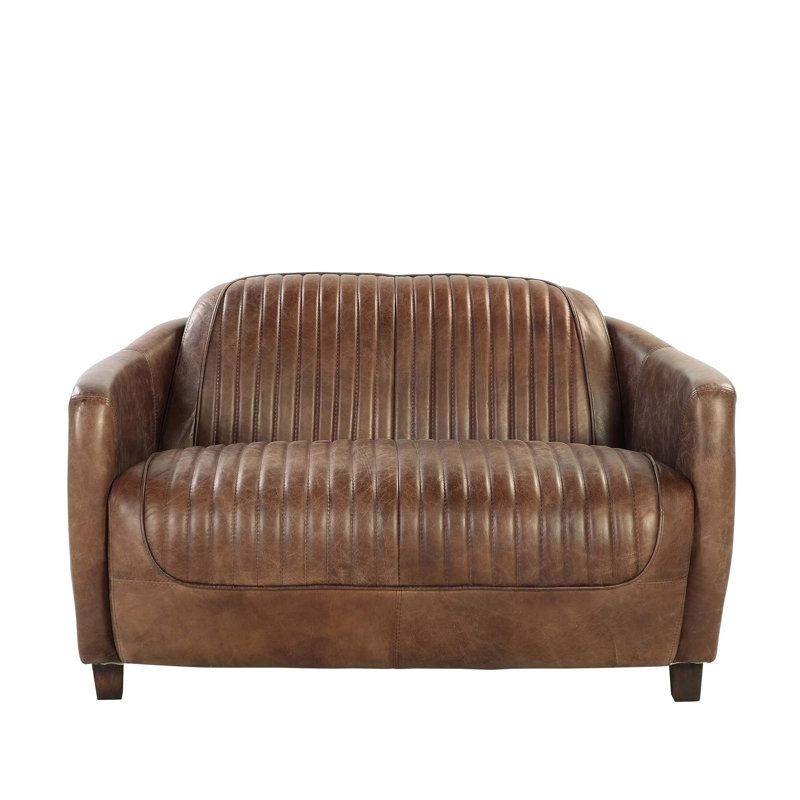 Fauteuil pivotant confortable avec repose-pieds et options de cuir polyvalentes pour des espaces élégants