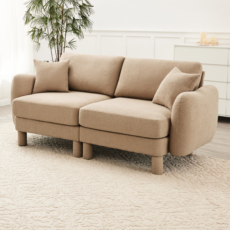 Canapé moderne 2 de couleur café avec tissu bouclé, pieds en forme de coquillage et cylindriques pour une assise optimale