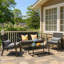 Ensemble de patio 4 pièces en osier 4 personnes - Causeuse, chaise et table basse avec coussins