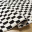 Tapis tissé à la machine en polyester noir / ivoire Caiah-2126779486