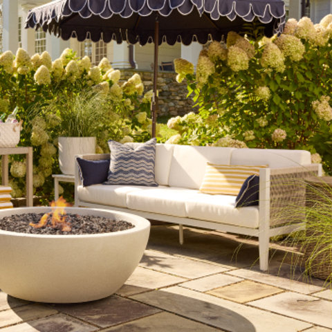 Outdoor seating area with fire pit.