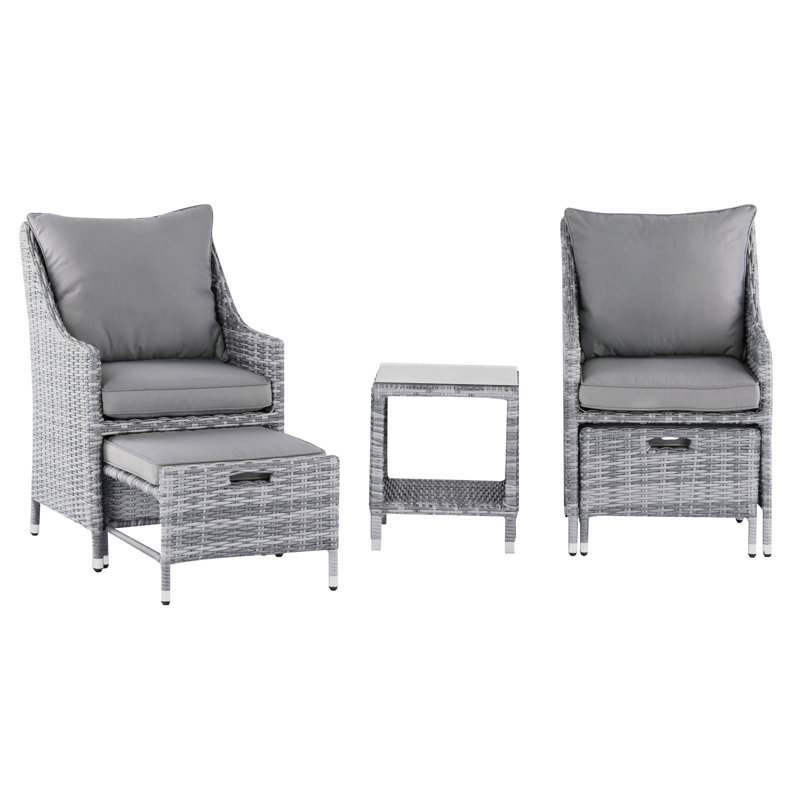 Ensemble de conversation d'extérieur en rotin 5 pièces avec chaises coussinées, repose-pieds et table d'appoint en verre Elle Decor