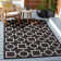 Arneshia Geometric Black/Beige Area Rug