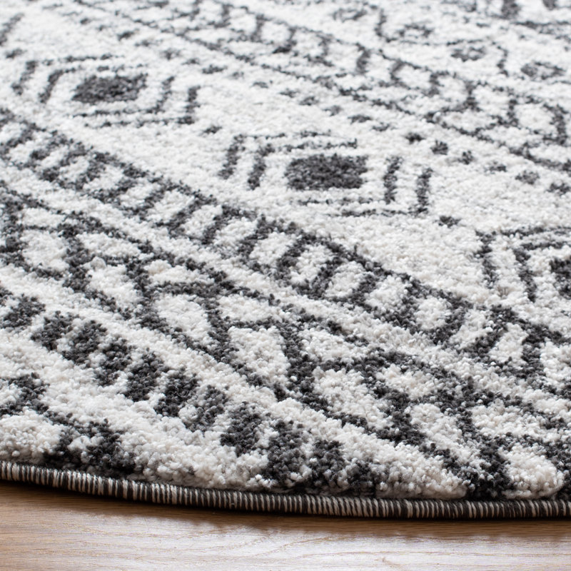Tapis ivoire / noir Jaylah Southwestern, Rond 6 pi 7 po