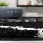 Tapis noir et blanc à motif géométrique-1644539959