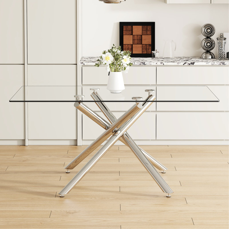 Magnifique table de salle à manger en verre de 63 x 35,4 x 30 pouces avec des pieds en métal argenté, ajoutant de la sophistication à un assemblage et une utilisation rectangulaires faciles