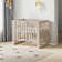 EvoNest 6-in-1 Portable Convertible Cradle to Mini Crib With Removable Wheels and Mattress
