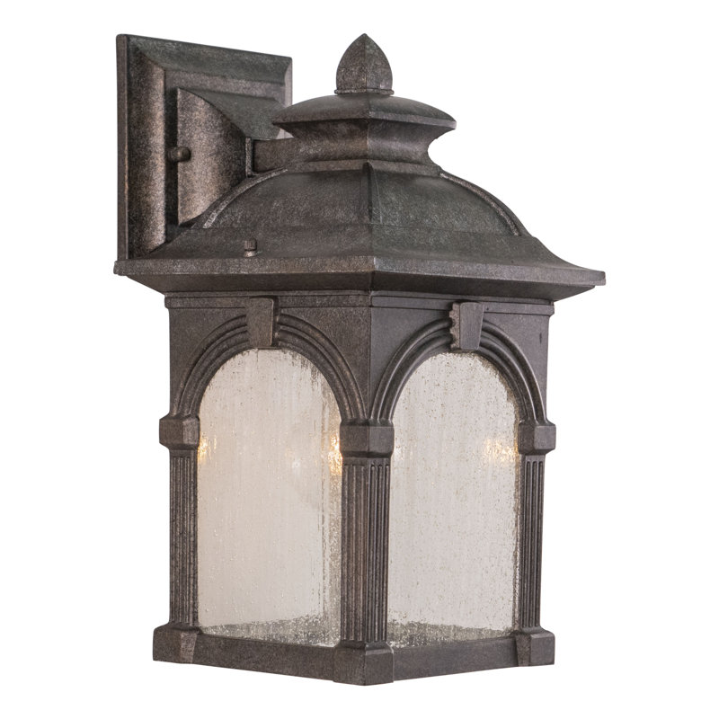 Rahul 13 in. H 1-Light Lava Stone Traditional Outdoor Wall Sconce made of Rust-Resistant Aluminum, Clear Seeded Glass Shade, LED Compatible, Use for Exterior Porch Patio Front Door or Garage