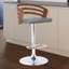 Tabouret tournant à hauteur réglable avec repose-pieds