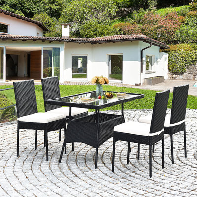 Ladera 4 - Person Wicker Patio Dining Set with Rectangular Table , Cushions Included