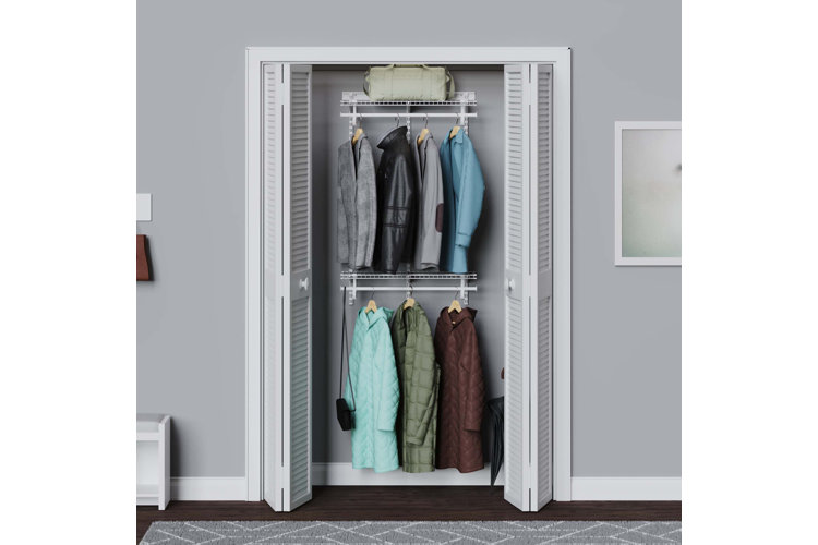 organized hallway coat closet with tiered garnment racks